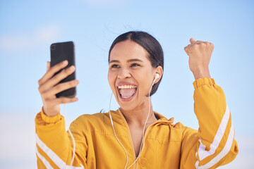 Happy woman, phone and fitness winning in celebration for workout milestone or outdoor achievement. Excited female person and fist pump in happiness for exercise goals or success on mobile smartphone