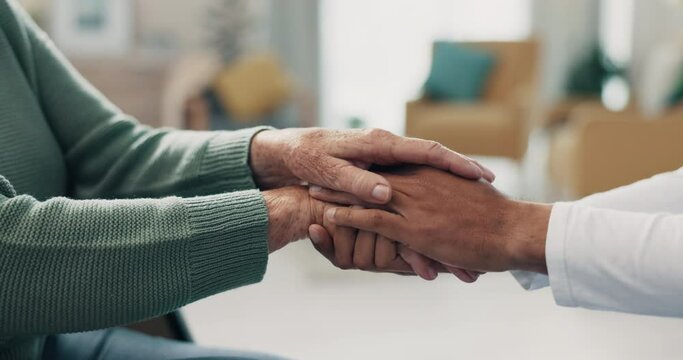 Holding hands, closeup and nursing home with doctor, support and faith with senior person in retirement. Nurse, elderly patient and homecare with praying, empathy and solidarity for healing in clinic