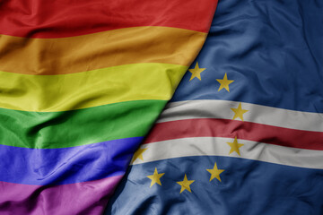 big waving realistic national colorful flag of cape verde and rainbow gay pride flag .