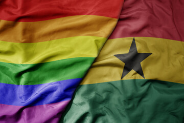 big waving realistic national colorful flag of ghana and rainbow gay pride flag . - obrazy, fototapety, plakaty