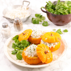 Baked stuffed pumpkin with rice and salad