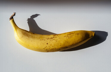 yellow banana on a white table