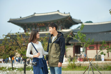  a couple traveling to famous tourist attractions in Korea