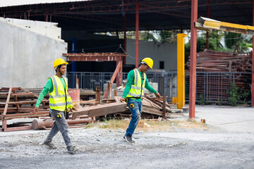Asian  man concrete factory worker working at precast factory. Engineering worker in safety hardhat at factory industrial facilities. Heavy Industry Manufacturing Factory. Prefabricated concrete walls