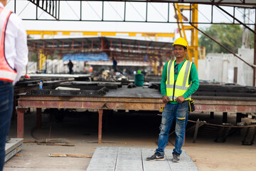 Fototapeta premium Portrait Asian professional Engineer factory. Engineering worker in safety hardhat at factory industrial facilities. Heavy Industry Manufacturing Factory. Prefabricated concrete walls