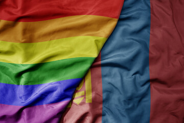 big waving realistic national colorful flag of mongolia and rainbow gay pride flag .