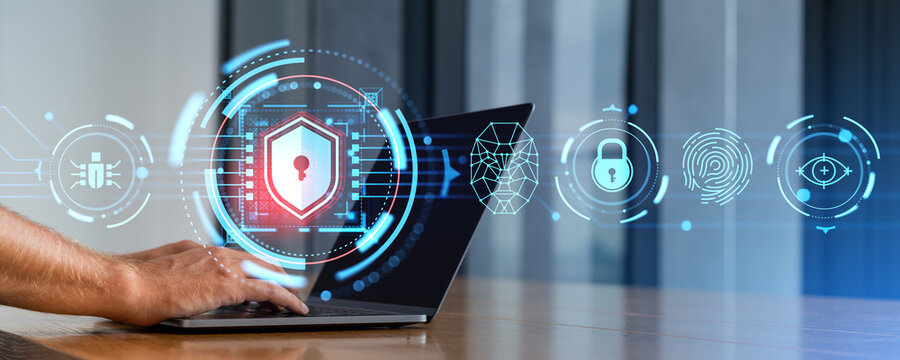 Man hands typing on laptop in office and cybersecurity shield interface