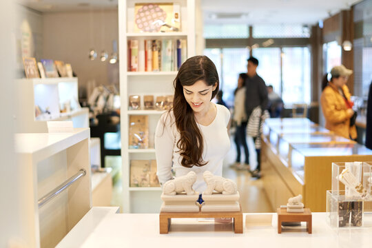 A foreign woman is shopping at a store.