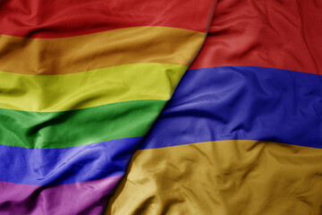 big waving realistic national colorful flag of armenia and rainbow gay pride flag .