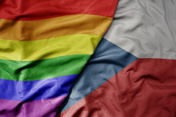 big waving realistic national colorful flag of czech republic and rainbow gay pride flag .