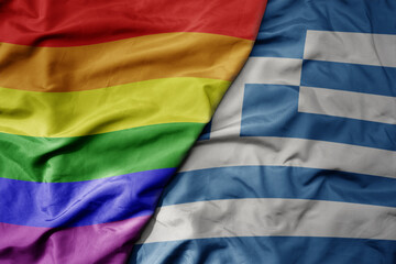 big waving realistic national colorful flag of greece and rainbow gay pride flag .