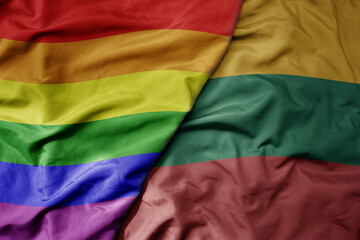 big waving realistic national colorful flag of lithuania and rainbow gay pride flag .