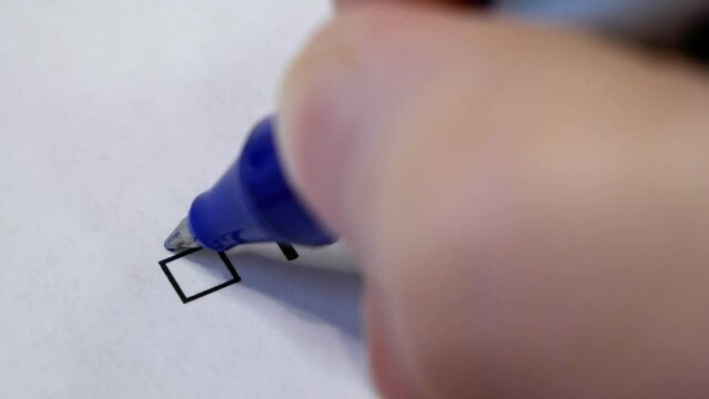 Hand daw in the questionnaire. A closeup of female hand answering about using kanban methodology in software development process question marking in a checkbox