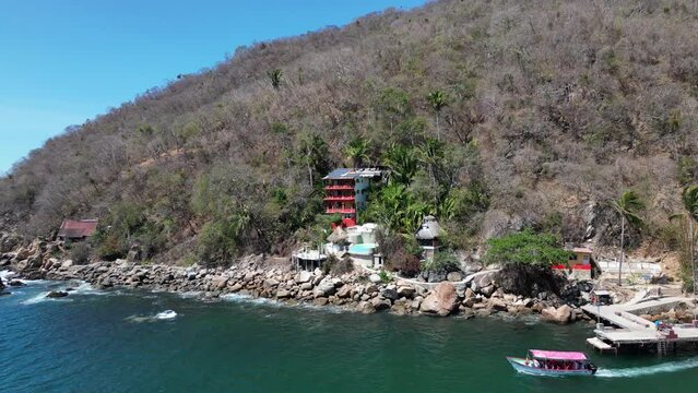 Amazing 4k drone footage of the pier and a hotel on Yelapa Beach