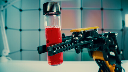 a robot holds a sample of a chemical substance