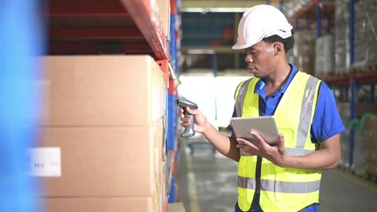 Portrait of smiling male warehouse worker using digital tablet in a warehouse - Powered by Adobe