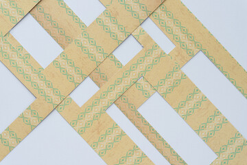 overlapping frames cut from decorative scrapbooking paper on white