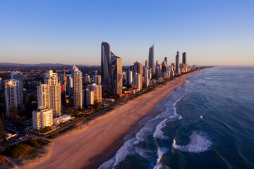 July 29 2023 -  Aerial view over Surfers Paradise famous beach and skyline at sunrise. Gold Coast, Australia.