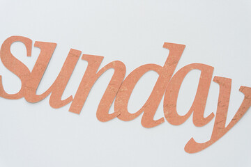 the word sunday composed with machine-cut letters 