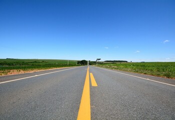 Closeup of a Paved road in the country side of the state of Sao Paulo, Brazil.