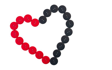 Heart from red and black buttons on a white background