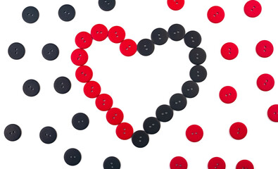 Heart from red and black buttons on a white background with red and black buttons