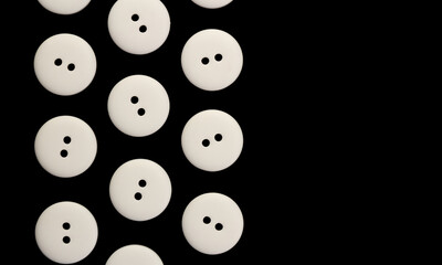 Black background with white round buttons