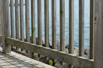 detail close-up of old wood fence around the look out deck by the lake