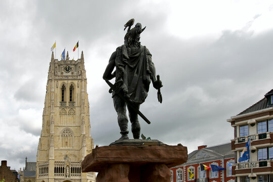 Statue of the gaulish Ambiorix with in front of him the basilica our lady of Tongeren in Limburg, Belgium