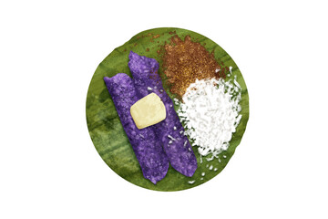 Fototapeta na wymiar Puto Bumbong is a beloved Filipino delicacy traditionally enjoyed during the Christmas season. It is a purple-colored rice cake made from glutinous rice and purple yam (ube), steamed in bamboo tubes. 