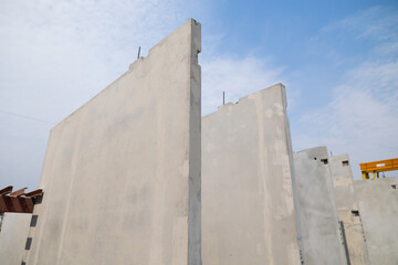 Prefabricated concrete walls for building office buildings and residential houses. Precast reinforced concrete wall panel for construction building.