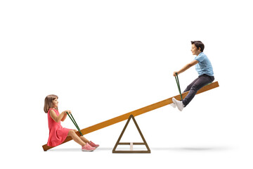 Children playing on a wooden seesaw