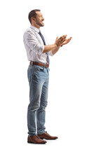 Full length profile shot of a man clapping with hands