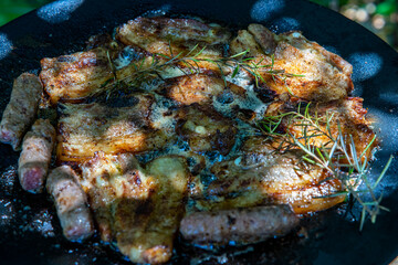 Obraz na płótnie Canvas grilled pork meat with spices, on a grill