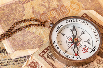 Fototapeta na wymiar Antique brass pocket compass, traditional navigation tool