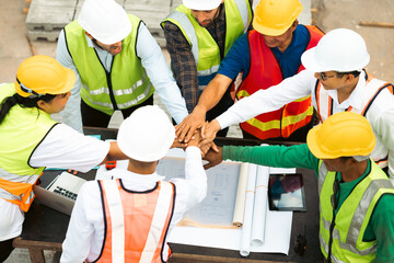 Group of professional Construction engineering people meeting and celebrate at Prefabricated concrete walls Industry Factory. Success teamwork. Ethnic diversity worker people. Unity and teamwork