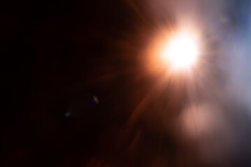 Blurred image Sun flare on the black background