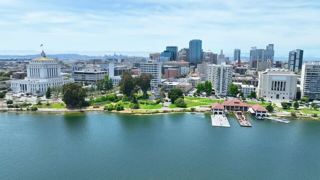 Boom up from Lake Merritt docks to view of Oakland City and distant San Francisco