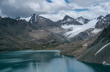 Fototapeta na wymiar Wonderful panorama of Ala Kul lake in Tien Shan mountains, Kyrgyzstan