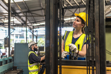 Factory worker woman working with forklift in factory warehouse © Jack Tamrong