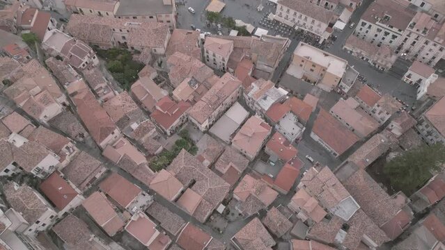 4k 25fps footage: aerial view of the medieval village of Pizzo in Calabria with its Murat castle, the Caribbean sea, the highway behind. The town is overlooking the sea.