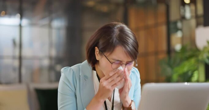 woman is sick at work