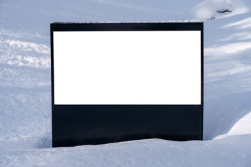 White horizontal billboard in the snow. Blank sign.