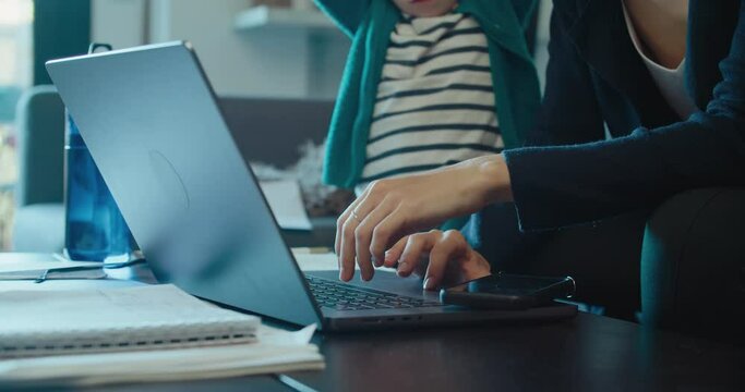 Freelancer businesswoman try to work at home and care of children