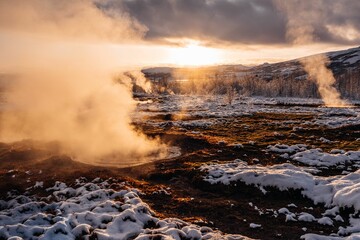 Breathtaking view of an icy snow-covered field in Reykjavik, Iceland during a stunning sunset