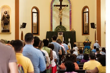 Fotobehang People lining up to eat christ's bread a catholic mass. © Djavan Rodriguez