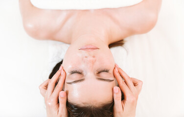 Lymphatic eye massage for reducing puffiness by professional massage therapist in beauty clinic
