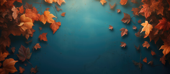 Autumn leaves on a blue background with copy space. Banner.
