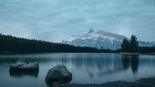 4K Moving Timelapse Sunrise Sunset at Two Jack Lake of Mount Rundle in Banff National Park, Alberta, Canada. Time Lapse alpenglow. Travel concept mountains.