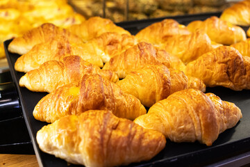sweet bagels are baked in the oven. Fresh Baked Croissant, Homemade pastry
